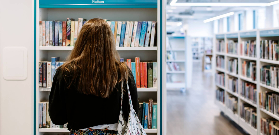 A student exploring the library